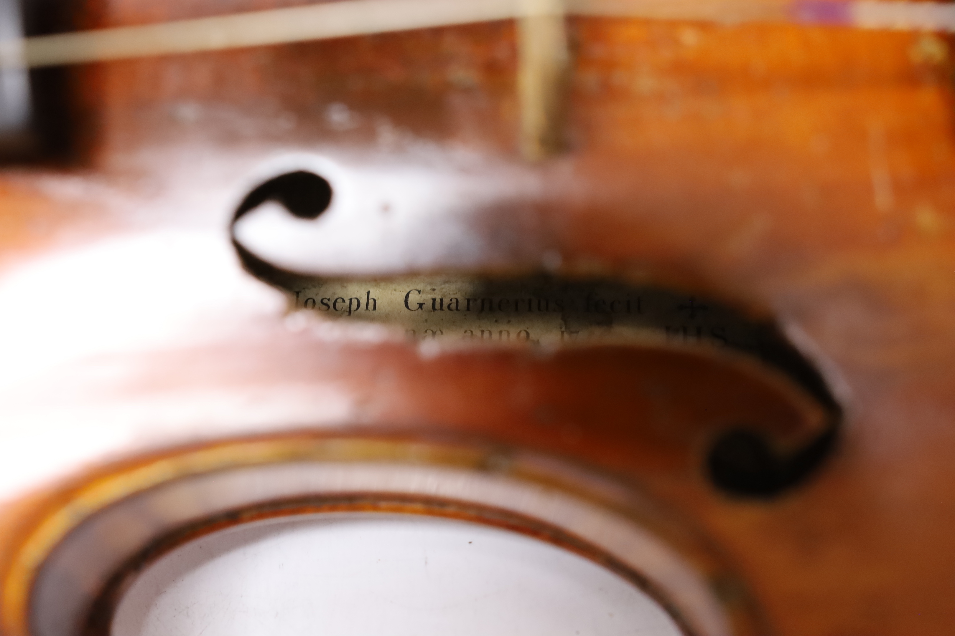 A cased late 19th/early 20th century French violin, bears Joseph Guarnerius label